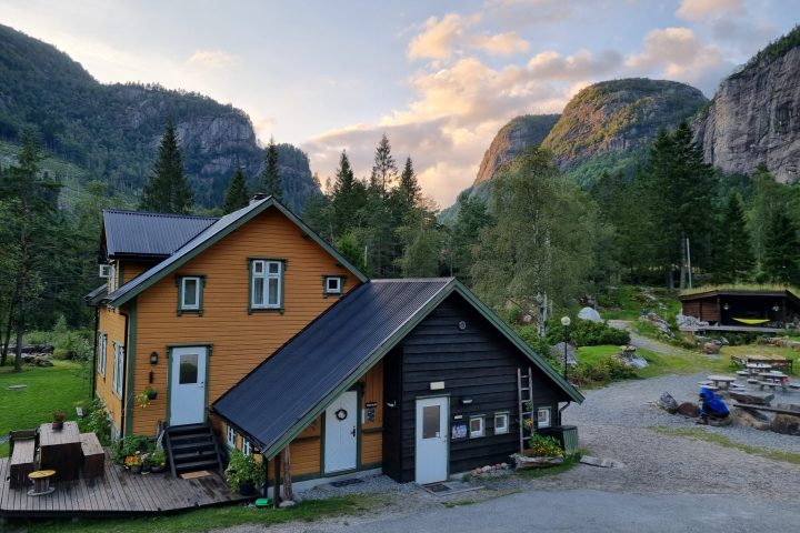 a house with a mountain in the background