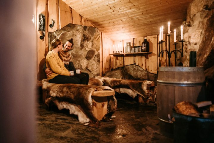 a couple inside a wooden room