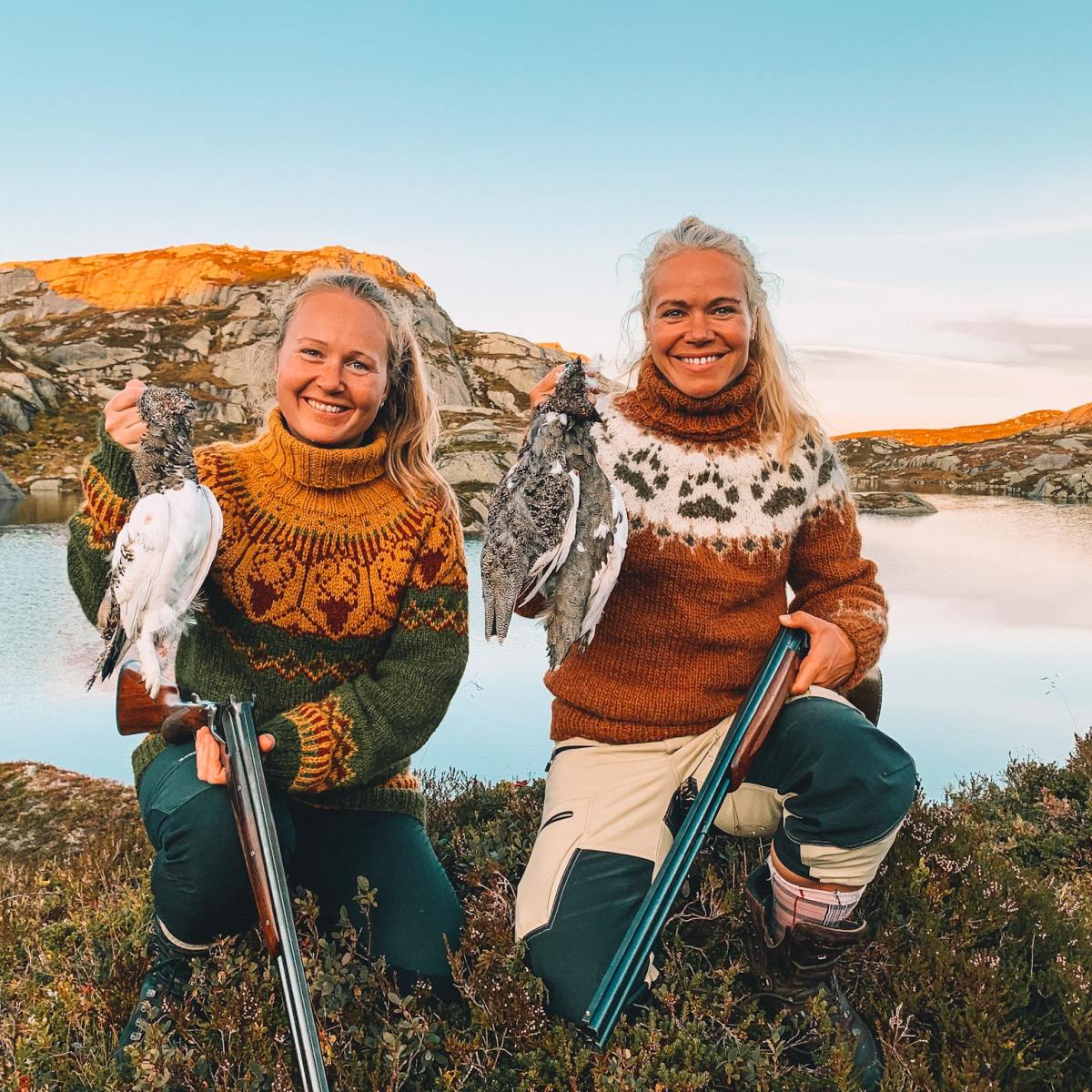 two women holding their hunted birds