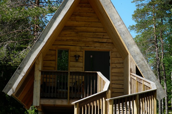 a wooden bench in front of a house