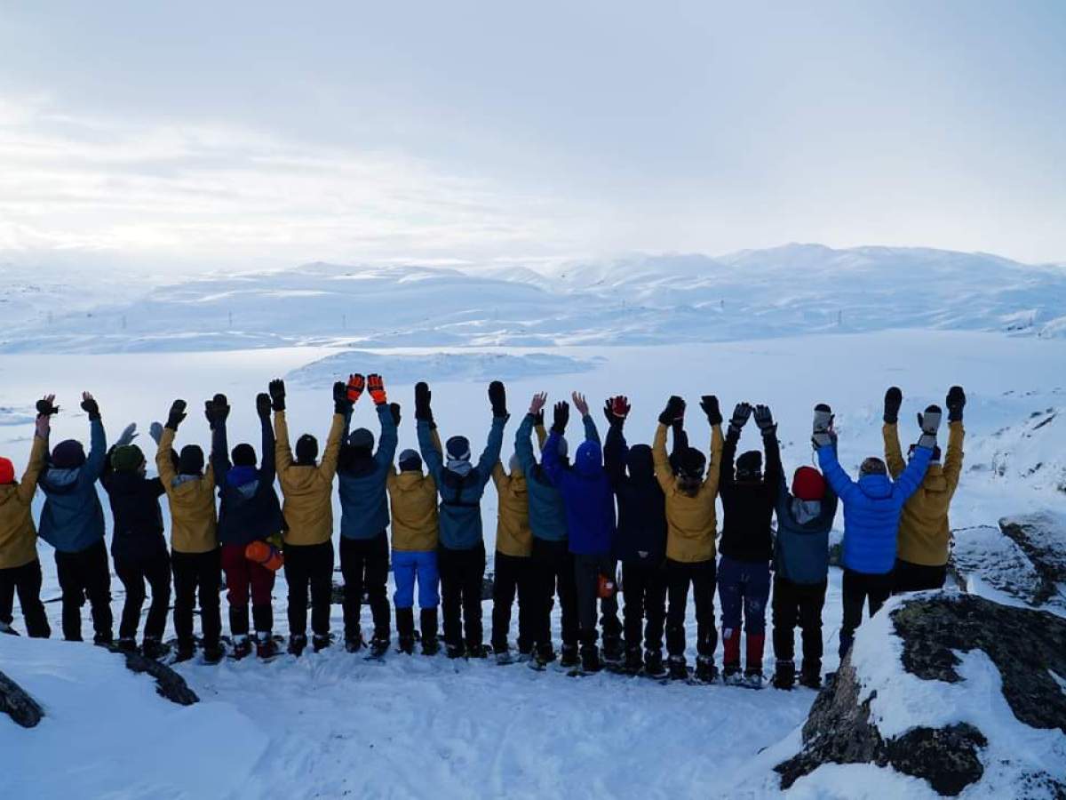 a group of people that are standing in the snow
