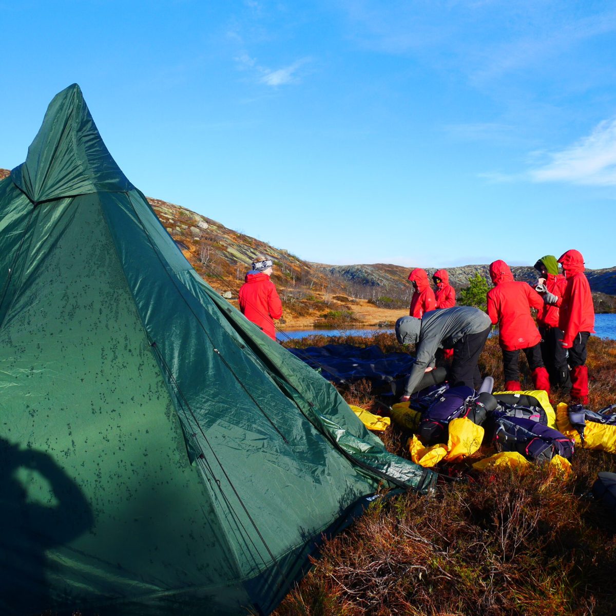 a man sitting on top of a mountain