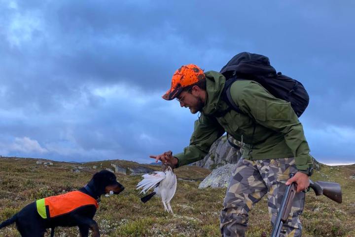 a man holding a dog