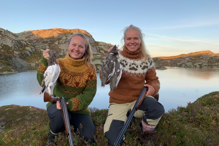 a person standing next to a body of water